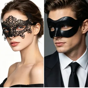 Detail of elegant black lace and matte couple masks for masquerade and party events
