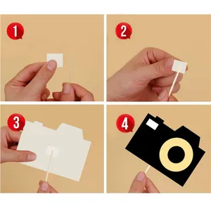 DIY Oscar party photo booth props kit with camera cutout and wooden sticks assembly guide