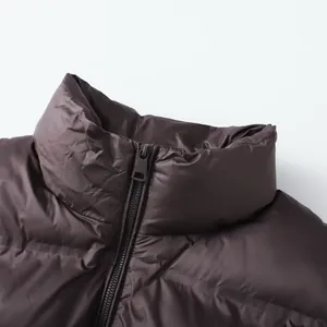 Fashionable dark coffee puffer vest with high stand collar and quilted detail