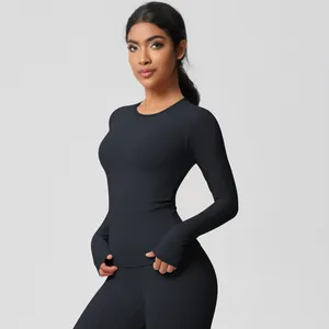 Close-up of black yoga set sleeve with functional thumbhole and brushed texture fabric