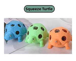 Detailed view of colorful squeeze turtle toys in blue, green and orange silicone
