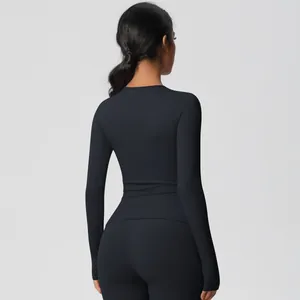 Detailed back view of a black long-sleeve yoga top with premium matte brushed fabric
