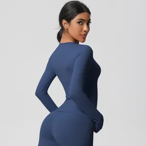 Close-up of seamless navy blue yoga set showing high-elasticity fabric and slim fit design