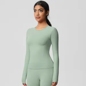 Detail of sage green yoga set showing smooth brushed fabric and slim fit design