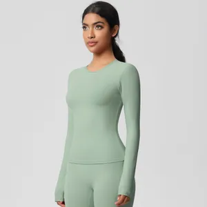 Close-up of mint green seamless yoga set featuring long sleeve top and slim fit leggings