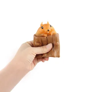 Stress-relief squeeze squirrel toy popping out of a brown tree stump for kids and adults