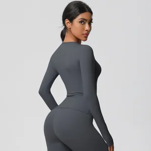 Detailed back view of women's charcoal grey slim-fit yoga set with high-waist leggings