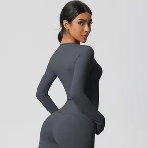 Detail of slim-fit dark grey yoga set showing the brushed fabric and elastic texture