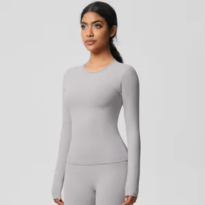 Detail of light gray brushed yoga set featuring tight long sleeve top and high waist leggings