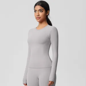 Detail of light gray yoga top with thumbholes and soft brushed athletic fabric