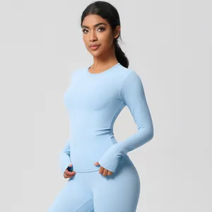 Close-up of light blue yoga set featuring thumbhole sleeves and high-stretch brushed fabric
