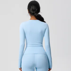 Rear view of light blue yoga set highlighting seamless stitching and fitted back design