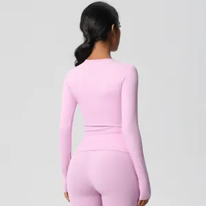 Rear view of slim fit yoga set with moisture-wicking fabric and elastic long sleeve top