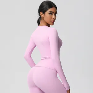 Detailed back view of light pink long sleeve yoga set with high waist seamless leggings