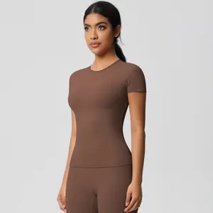 Close-up of slim-fit cocoa brown yoga set featuring high-waisted leggings and short sleeve top