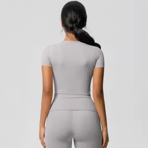 Rear view of grey yoga set with slim fit t-shirt and high waist leggings for women