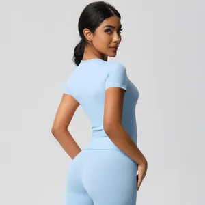 Three-quarter back view showing fit and contour of high-waist yoga set in light blue