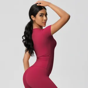Close-up of wine red slim fit yoga set fabric texture with moisture-wicking technology