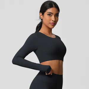 Close-up of matte black slim fit long sleeve yoga top with moisture-wicking fabric