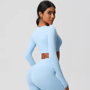 Detailed side-back view of light blue seamless long sleeve yoga top and leggings set