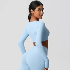 Back view of light blue yoga set with high waist leggings and long sleeve crop top