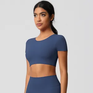 Detail of high-stretch navy blue yoga crop top and high-waisted seamless leggings