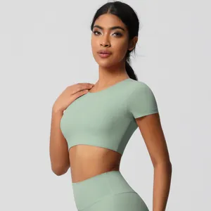 Detailed side view of mint green women's fitness set featuring tight yoga leggings and top