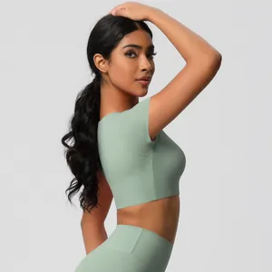 Close-up of seamless light green yoga set showing high-stretch quick-dry fabric texture