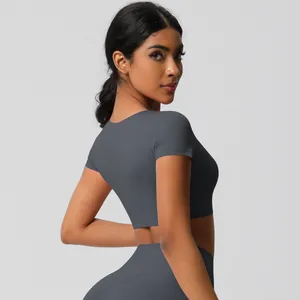 Detail of dark grey seamless yoga set showing high-waist fit and soft brushed texture
