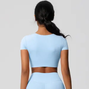 Rear view of light blue moisture-wicking yoga set featuring high-waist leggings and crop top