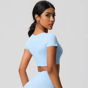 Side view of light blue fitness set with short sleeve crop top and matching leggings