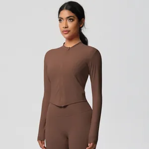 Detail view of high-stretch chocolate brown zip-up yoga top and high-waist leggings set