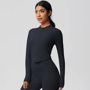 Close-up of black tight brushed yoga set featuring slim fit zip jacket and high waist leggings