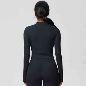 Rear view of black brushed yoga set showing slim-fit fabric and athletic silhouette