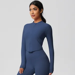 Detail of navy blue slim fit yoga set featuring full-zip long sleeve jacket and high waist leggings