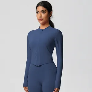 Detail of slim-fit dark blue long sleeve zip-up jacket and yoga leggings set