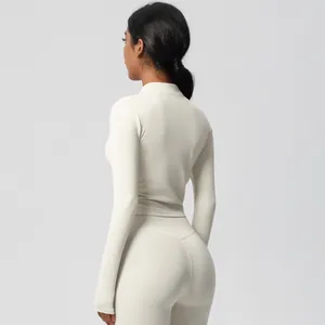 Rear view of cream yoga set with slim-fit long sleeve top and high-waisted leggings
