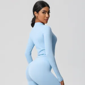 Slim fit light blue yoga set with high waist leggings and zipper long sleeve top