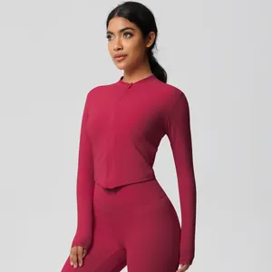 Detail view of rose red tight yoga set featuring stand collar jacket and high waist leggings