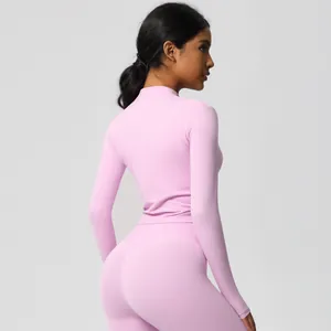 Detail of light pink yoga set showing high-elasticity fabric and slim fit design