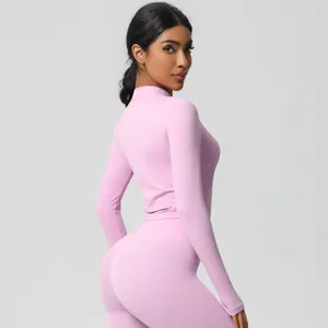 Detail view of pink lavender long sleeve yoga set featuring high waist leggings and slim fit top