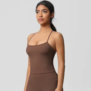 Detail of high-stretch brown yoga set with slim strap top and high-waist leggings