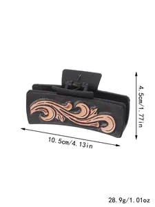 Pince à cheveux rectangulaire noir mat avec motifs en relief bronze, longueur 10,5 cm