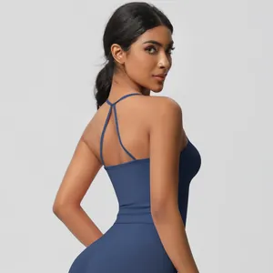 Detail of navy blue yoga sports bra with criss-cross back straps and elastic fabric