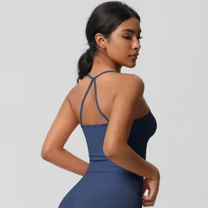 Detail of navy blue yoga set showing criss-cross back straps and elastic fabric texture