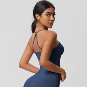 Detail of navy blue yoga jumpsuit with crisscross back straps and slim fit design