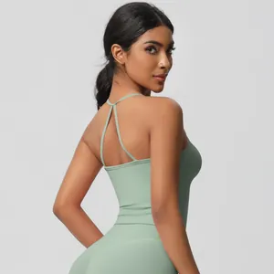 Close-up of mint green yoga set featuring a cross-back strap design and quick-dry fabric