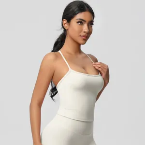 Detail of cream yoga set showing U-neck sports bra and high-waisted leggings texture