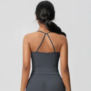 Detail of cross-back straps and charcoal matte elastic fabric on women's yoga vest