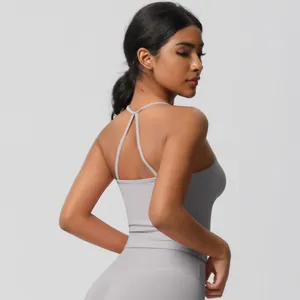 Detail of grey seamless yoga set featuring open back tank top and high waist leggings